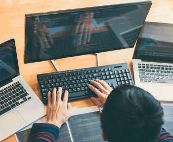 Professional Development programmer working in programming website a software and coding technology